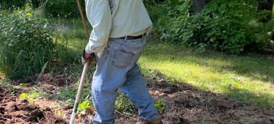 An elderly white man working in a garden of rich dark soil, he is holding a tool and is working the soil. The text reads "An Open Letter to My Bishop (ELCA New England)."