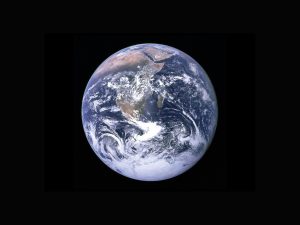 Earth from outer space, black sky all around it