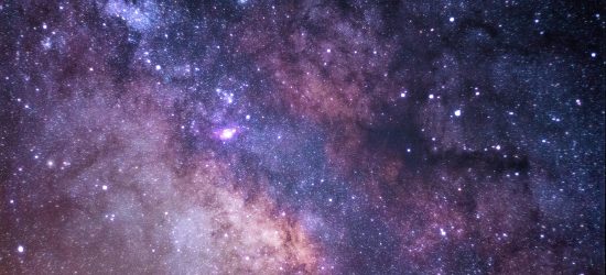 dark purples of the sky, the cosmos, splotches of brighter and darker colors, almost like a watercolor painting