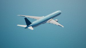 an airplane angled up in a blue sky