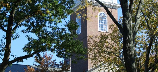 Memorial Church in Harvard, white steeple, columns on the lower part